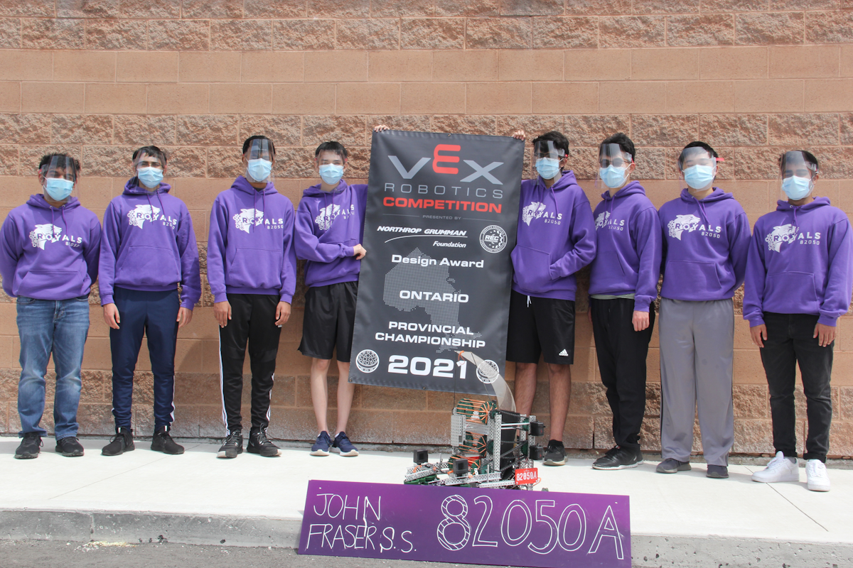 Team with design award banner and robot during Change Up